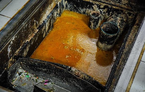 grease trap cleaning helps prevent grease and oil from entering the drain system, thus reducing the risk of environmental contamination